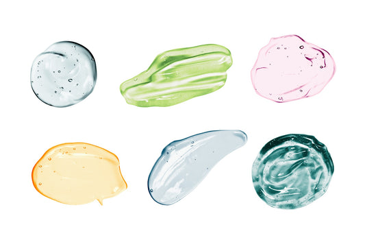 Different colored, transparent skincare products